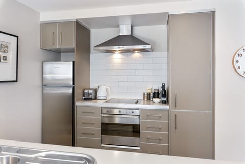 Design Apartment | Private kitchen | Full-size fridge, microwave, oven, stovetop