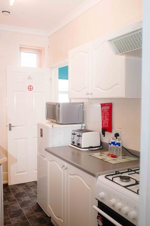 Family Apartment, Ground Floor | Private kitchen | Full-size fridge, microwave, oven, stovetop