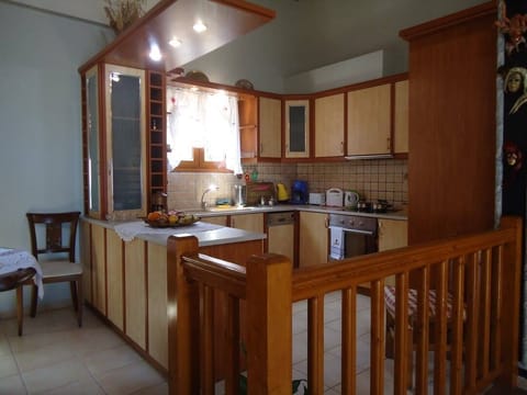 Villa | Private kitchen | Full-size fridge, oven, toaster, cookware/dishes/utensils