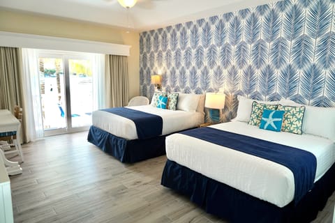 Deluxe Room, 2 Queen Beds, Lagoon View | In-room safe, individually decorated, laptop workspace, blackout drapes