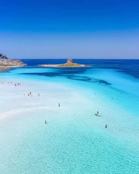 Beach nearby, white sand, beach shuttle, beach umbrellas