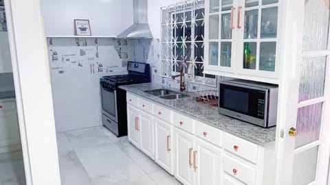 Villa | Private kitchen | Fridge, microwave, oven, stovetop