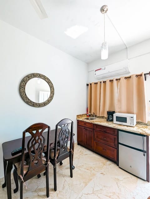 Mini-fridge, microwave, coffee/tea maker, cookware/dishes/utensils