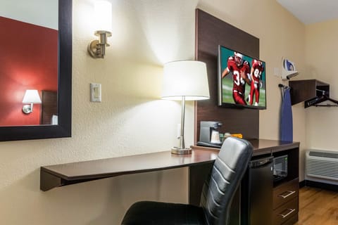 Desk, laptop workspace, blackout drapes, iron/ironing board