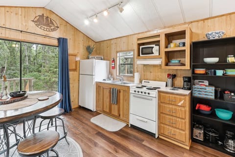 Cabin, 1 Bedroom | Private kitchen | Fridge, oven, coffee/tea maker, toaster