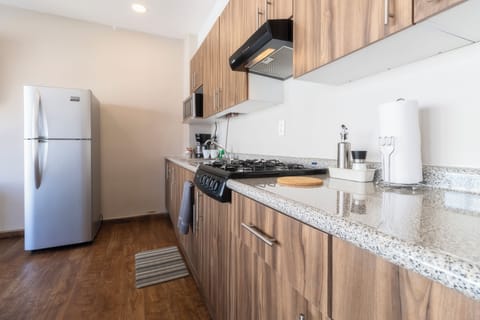 Family Apartment F401 | Private kitchen | Full-size fridge, microwave, stovetop, coffee/tea maker