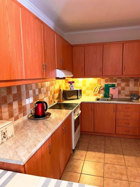 Comfort Apartment | Private kitchen | Full-size fridge, microwave, oven, stovetop