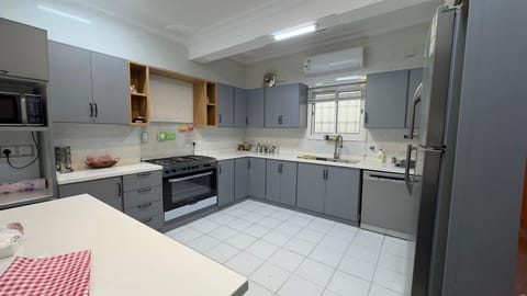 Luxury Suite | Private kitchen | Mini-fridge, stovetop, electric kettle, cookware/dishes/utensils