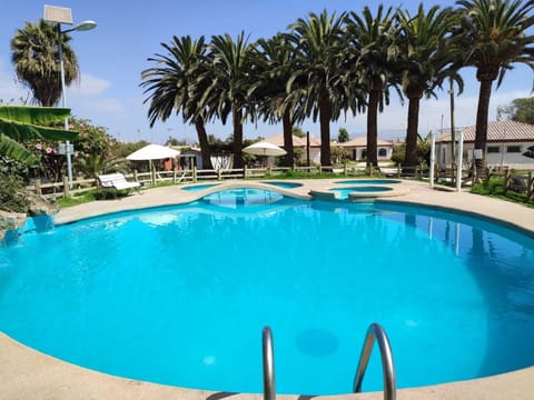 3 outdoor pools, open 11:00 AM to 8:00 PM, pool umbrellas