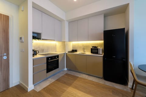 Design Apartment, 1 Bedroom, Courtyard View | Private kitchen | Full-size fridge, microwave, oven, stovetop