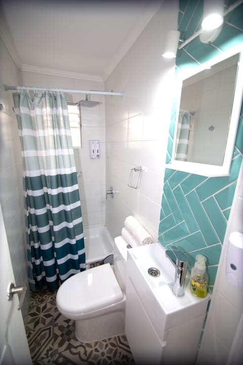 Economy Double Room, Courtyard View | Bathroom | Shower, rainfall showerhead, hair dryer, towels