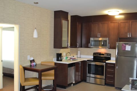 Suite, 1 Bedroom | Private kitchen | Full-size fridge, microwave, stovetop, dishwasher