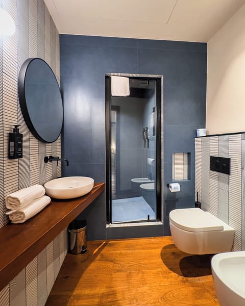 Comfort Room, City View | Bathroom | Hair dryer, bidet, towels