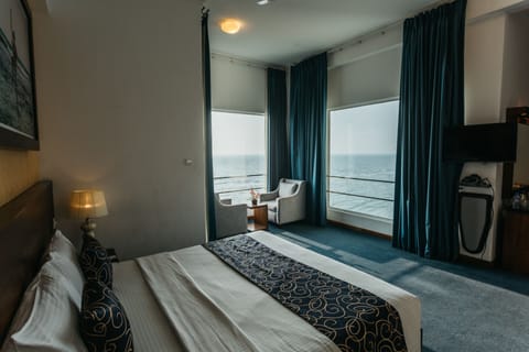 Deluxe Double or Twin Room, Ocean View | Minibar, in-room safe, desk, laptop workspace