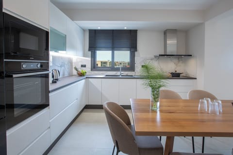 Suite, 2 Bedrooms | Private kitchen | Full-size fridge, microwave, oven, stovetop