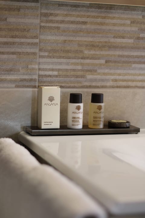 Shower, rainfall showerhead, designer toiletries, hair dryer