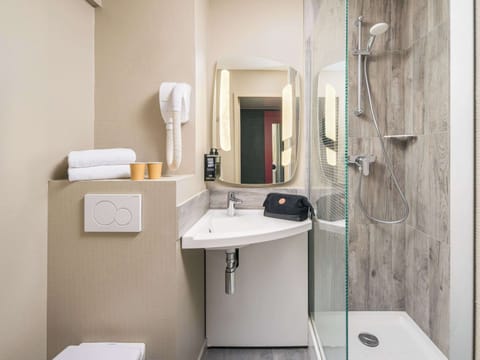 Shower, eco-friendly toiletries, hair dryer, towels