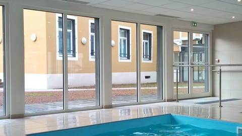 Indoor pool, sun loungers