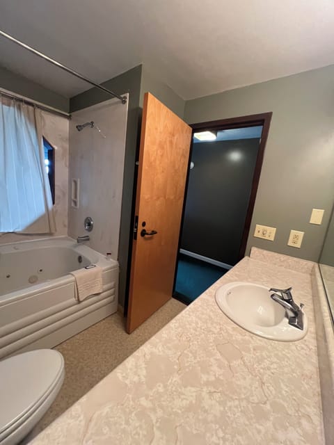 Combined shower/tub, hair dryer, towels, soap