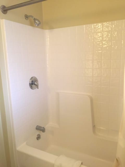 Standard Room, 1 King Bed | Bathroom | Combined shower/tub, hair dryer, towels