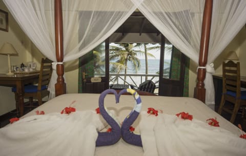 Romantic Double Room, 1 Queen Bed, Balcony, Beachfront | In-room safe, desk, free WiFi, bed sheets