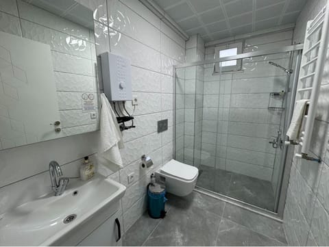 Shower, rainfall showerhead, hair dryer, towels