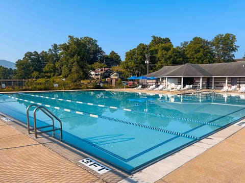 Seasonal outdoor pool, open 10:00 AM to 8:00 PM, pool umbrellas