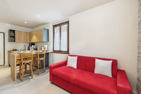 Standard Apartment, 1 Bedroom (Appartamento 30 NODI Torbole) | Living area | Flat-screen TV