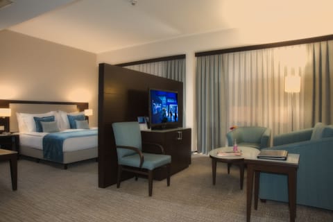 Junior Suite, Balcony, City View | Down comforters, minibar, in-room safe, iron/ironing board