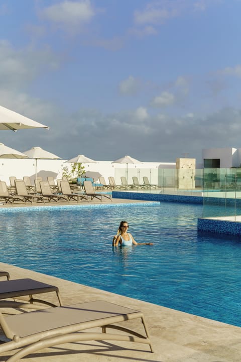 4 outdoor pools, open 9:00 AM to 10:00 PM, pool umbrellas, sun loungers