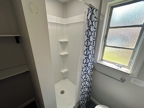 Deluxe Studio Suite | Bathroom | Shower, hair dryer, towels, soap