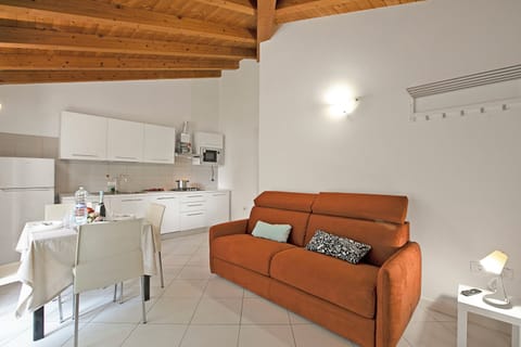 Family House, 2 Bedrooms (Il Giardino di Sara) | Living area | 21-inch flat-screen TV with cable channels, TV