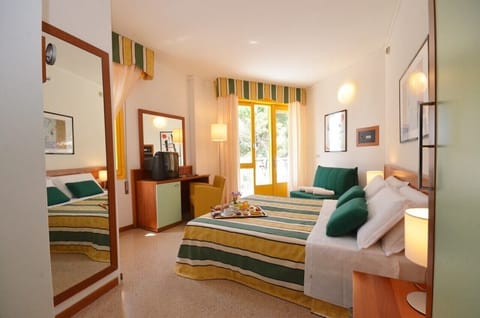 Triple Room, Balcony | Minibar, in-room safe, desk, free WiFi