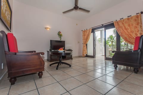 Grand Family Suite Garden & Pool View | Living area | Flat-screen TV