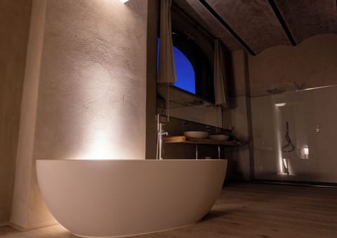 Separate tub and shower, free toiletries, hair dryer, slippers