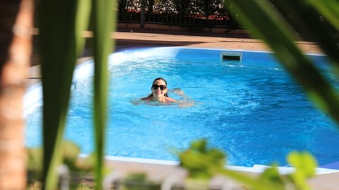 Outdoor pool, open 2:00 PM to 8:00 PM, sun loungers