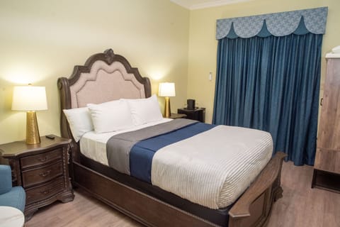 Deluxe Room, Garden View | Blackout drapes, iron/ironing board, free WiFi