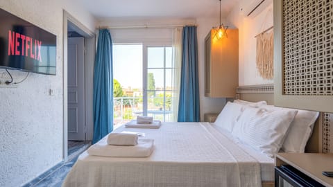 Deluxe Double Room, 1 Queen Bed, Balcony, Pool View | In-room safe, blackout drapes, soundproofing, iron/ironing board