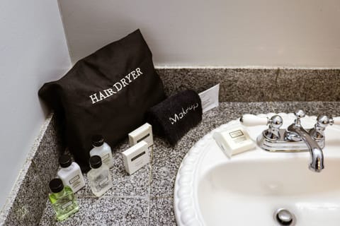 101 Rockport Suite | Bathroom | Combined shower/tub, designer toiletries, hair dryer, bathrobes