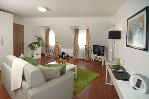 Suite, 2 Bedrooms | Living area | 40-inch LED TV with cable channels, TV