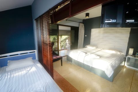 Family Triple Room, Multiple Beds, Balcony, Garden Area | In-room safe, individually furnished, blackout drapes, free WiFi