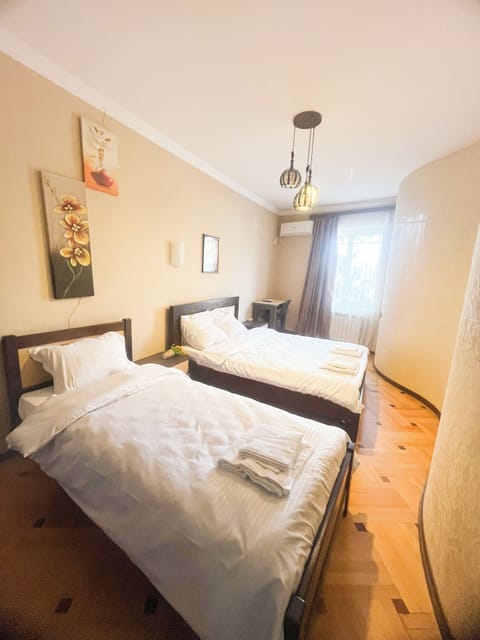 Deluxe Triple Room, City View | Desk, laptop workspace, free WiFi