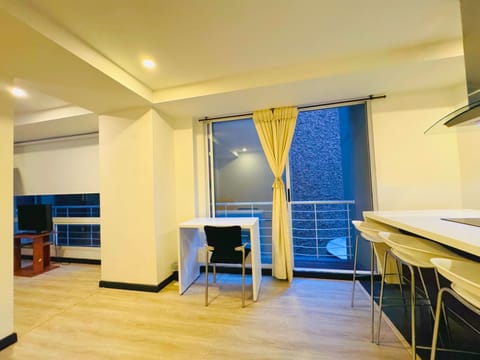 Deluxe Apartment, 1 Bedroom | Living area | 32-inch flat-screen TV with satellite channels, TV