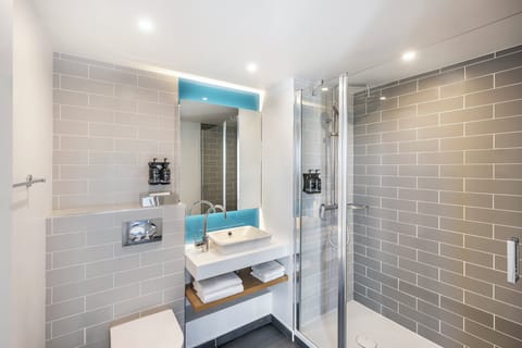 Shower, rainfall showerhead, hair dryer, towels