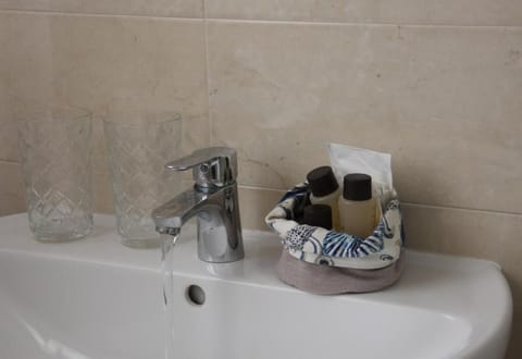Combined shower/tub, hair dryer, bathrobes, slippers