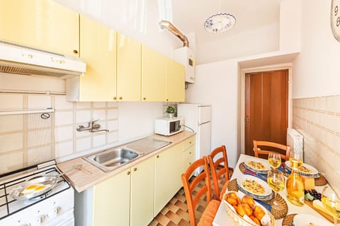 Apartment, Balcony | Private kitchen | Full-size fridge, microwave, oven, stovetop