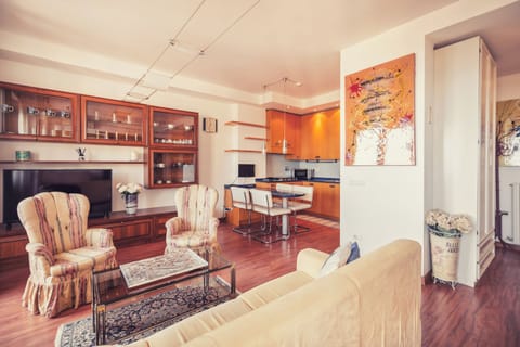 Apartment, Sea View | Living area | 35-inch TV with digital channels