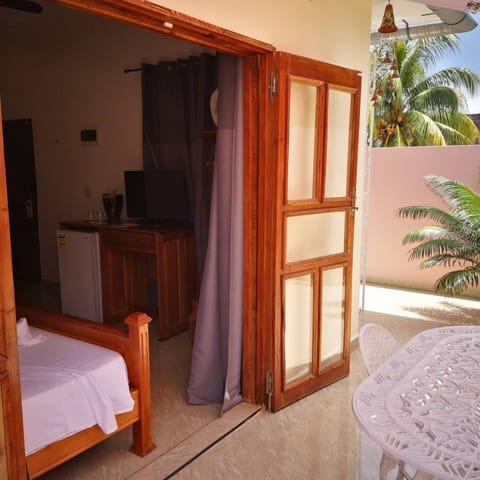 Exclusive Triple Room, Balcony, Mountain View | Minibar, in-room safe, individually decorated, individually furnished