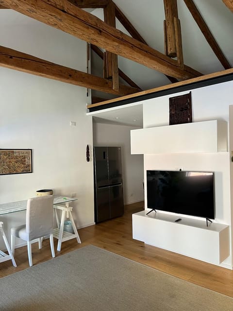 Comfort Apartment, Canal View | Living area | 50-inch Smart TV with digital channels