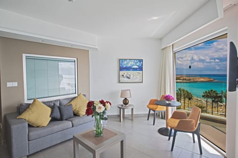 Deluxe Suite, Sea View | Minibar, in-room safe, desk, soundproofing